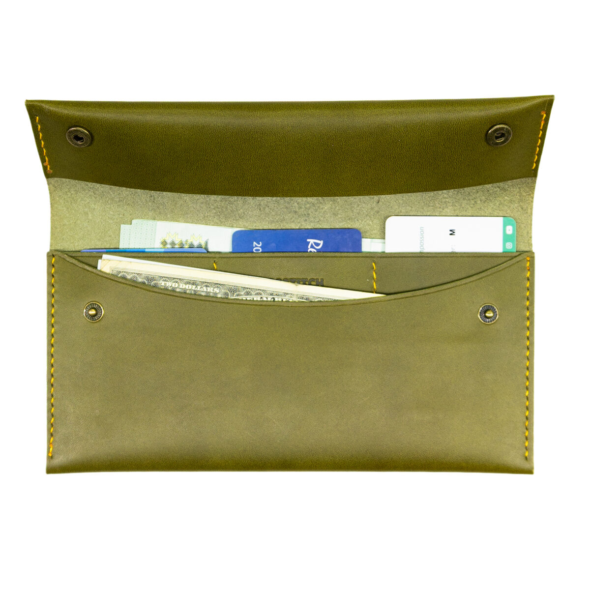 Crosstitch Leather olive green long wallet holding cards and cash, made from full-grain vegetable-tanned leather.
