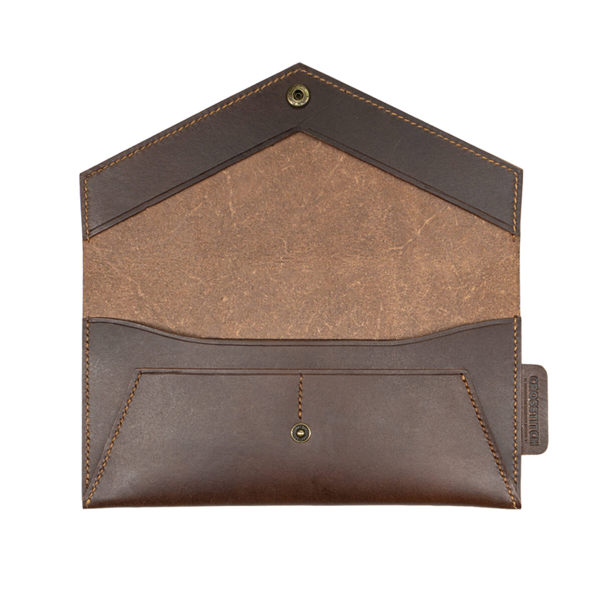 Interior of Crosstitch Leather’s brown vegetable-tanned money envelope, showing magnetic closure and internal pocket.