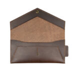 Interior of Crosstitch Leather’s brown vegetable-tanned money envelope, showing magnetic closure and internal pocket.