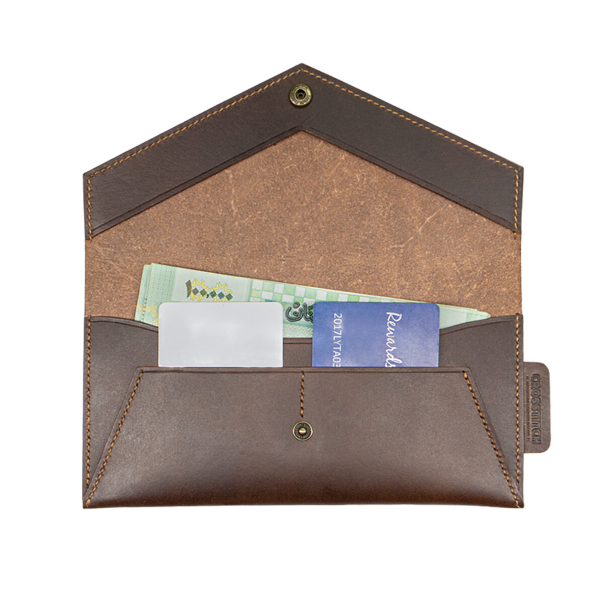 Crosstitch Leather money envelope with cash and cards inside, made from full-grain brown leather with handcrafted stitching.