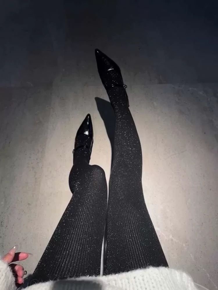 1002586018 A. Shimmery Ribbed Black Tights
